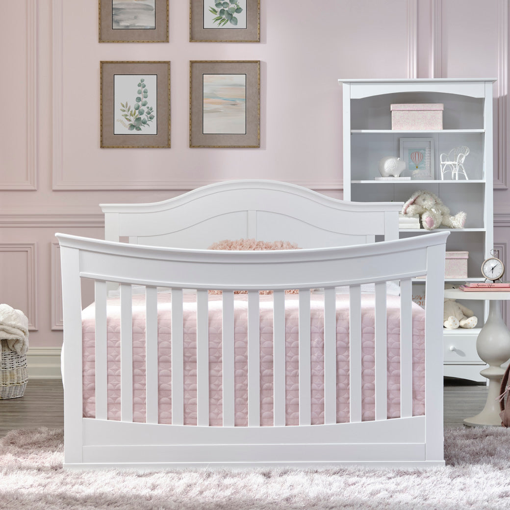 DaVinci Meadow 4-in-1 Convertible Crib as full-size bed next to a shelf in -- Color_White