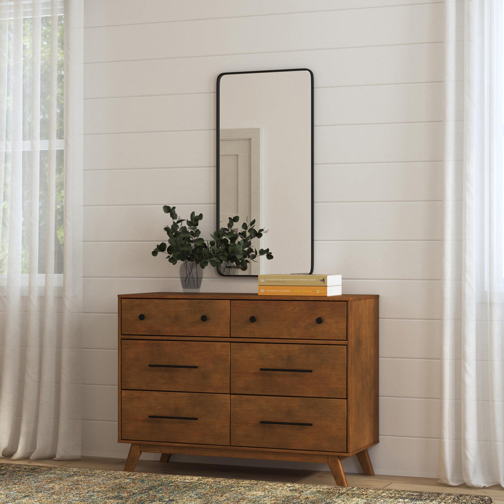 DaVinci Otto 6-Drawer Dresser under a mirror with a plant on top in -- Color_Walnut