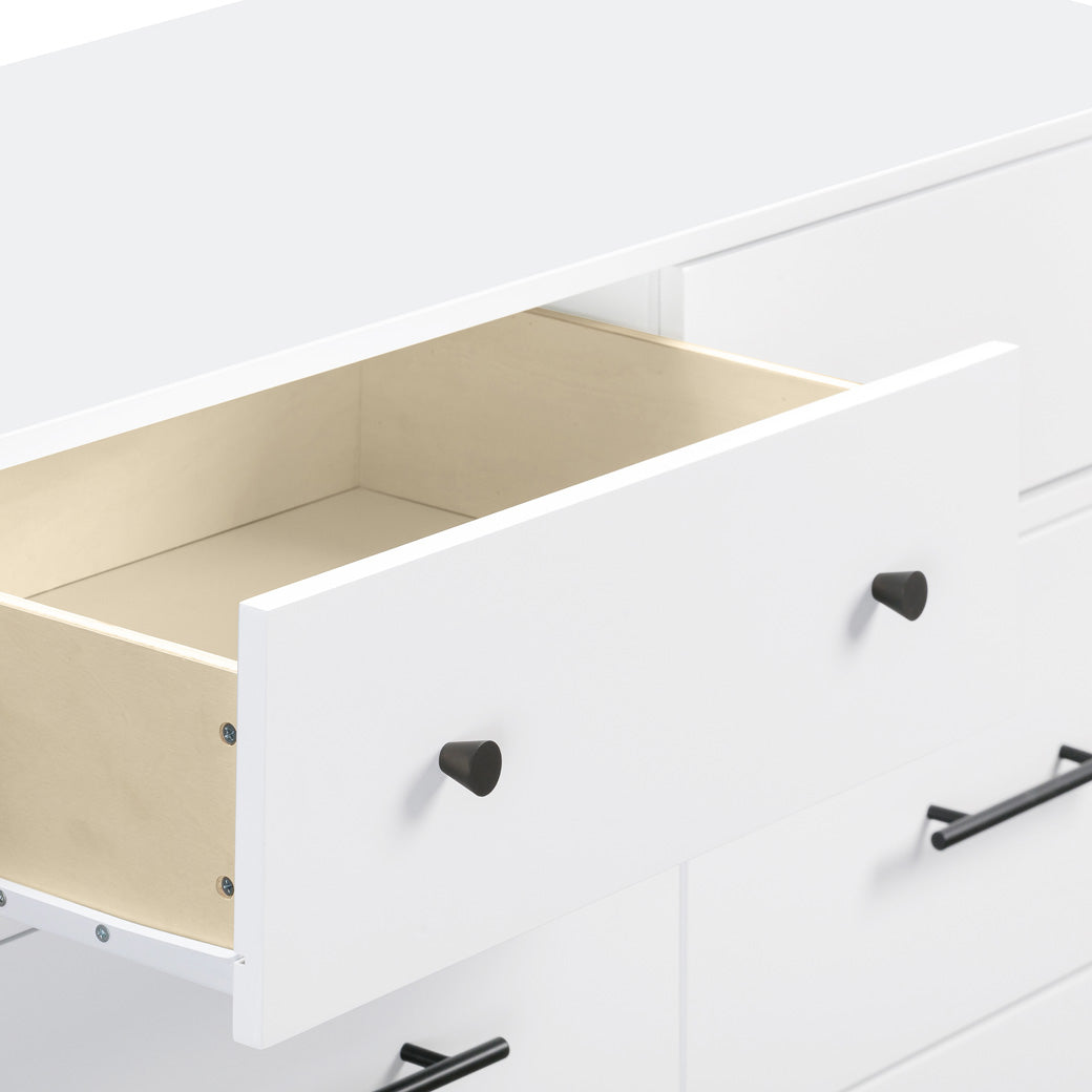 Closeup of an open drawer of the DaVinci Otto 6-Drawer Dresser in -- Color_White