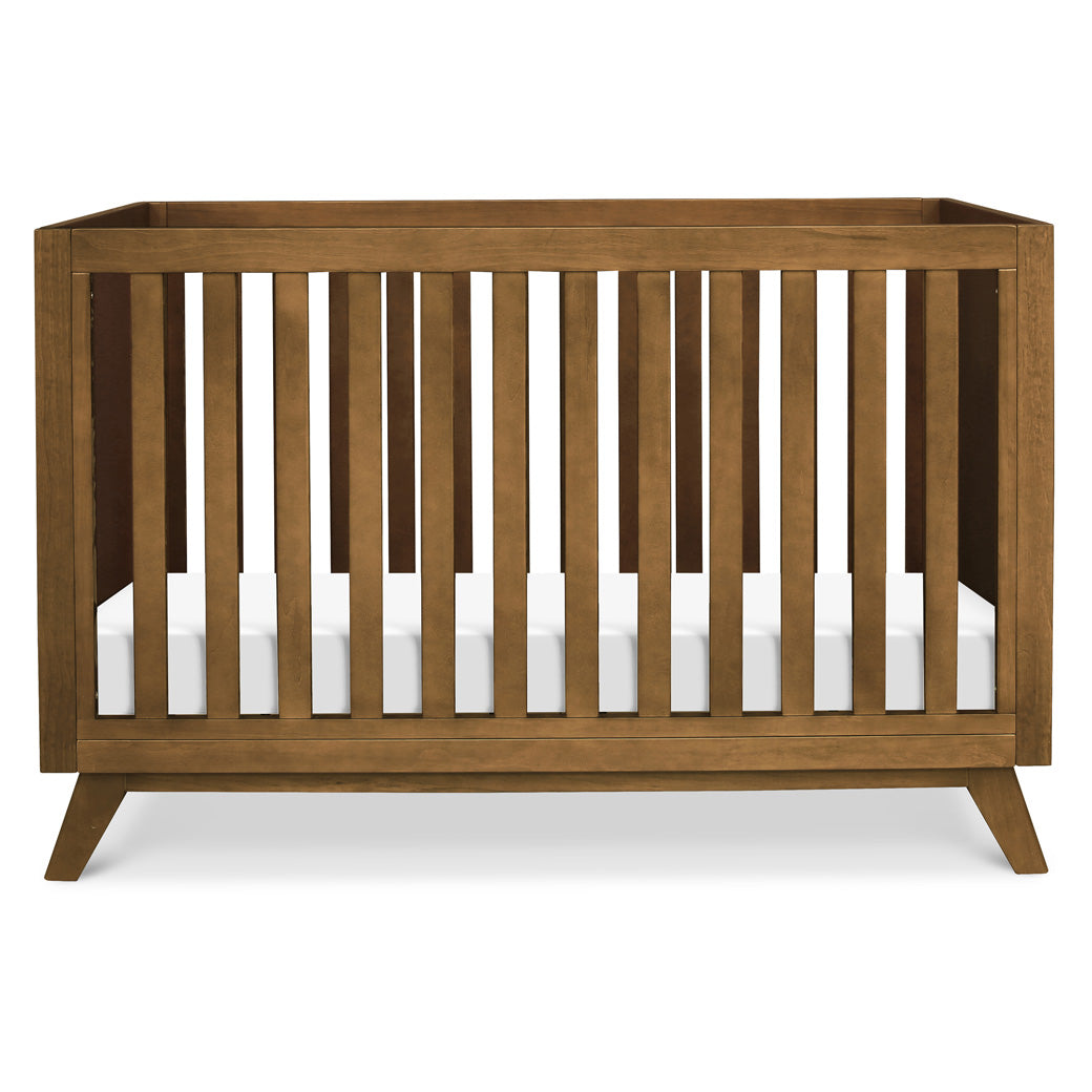 Front view of DaVinci Otto 3-in-1 Convertible Crib in -- Color_Walnut _ Wood