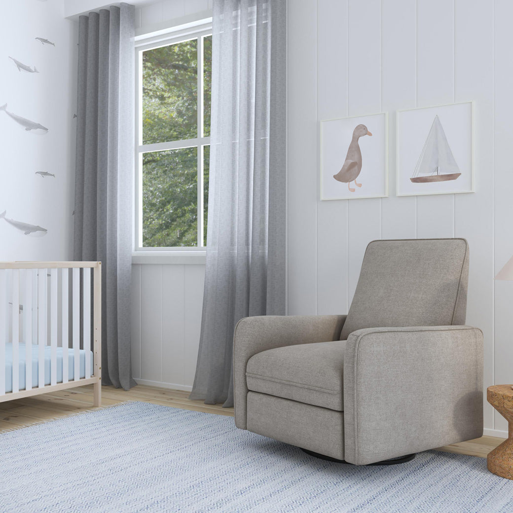 DaVinci's Penny Recliner And Swivel Glider next to a window and crib in -- Color_Performance Grey Eco-Weave