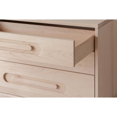 Closeup of Kalon Caravan Double Dresser with open drawer in -- Color_Oiled Ash