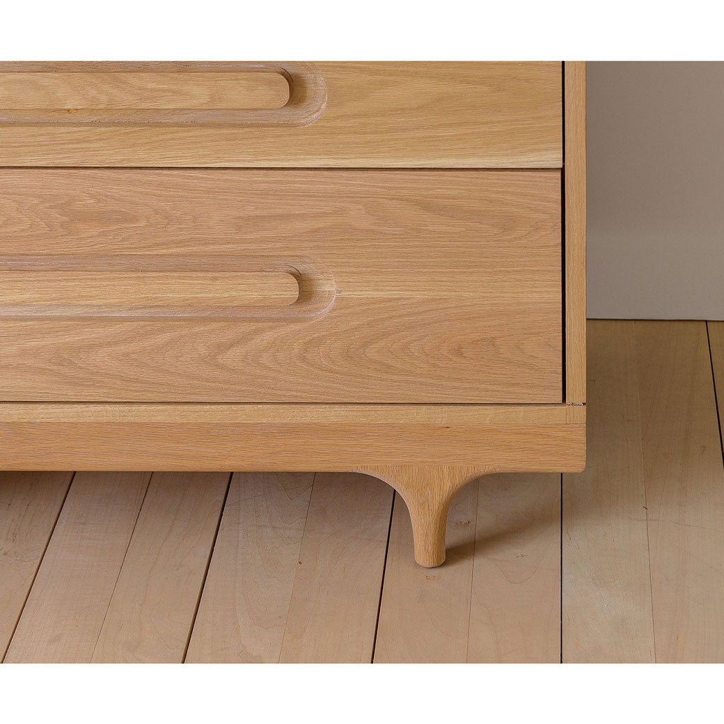 Closeup of Kalon Caravan Dresser right leg in -- Color_White Oak