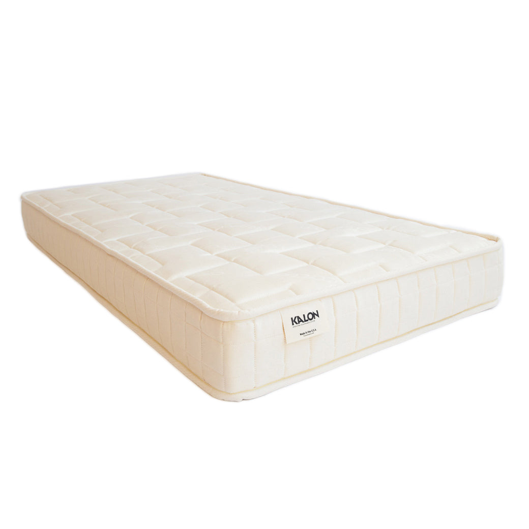 kalon dream no.1 crib mattress at an angle -- Color_Natural