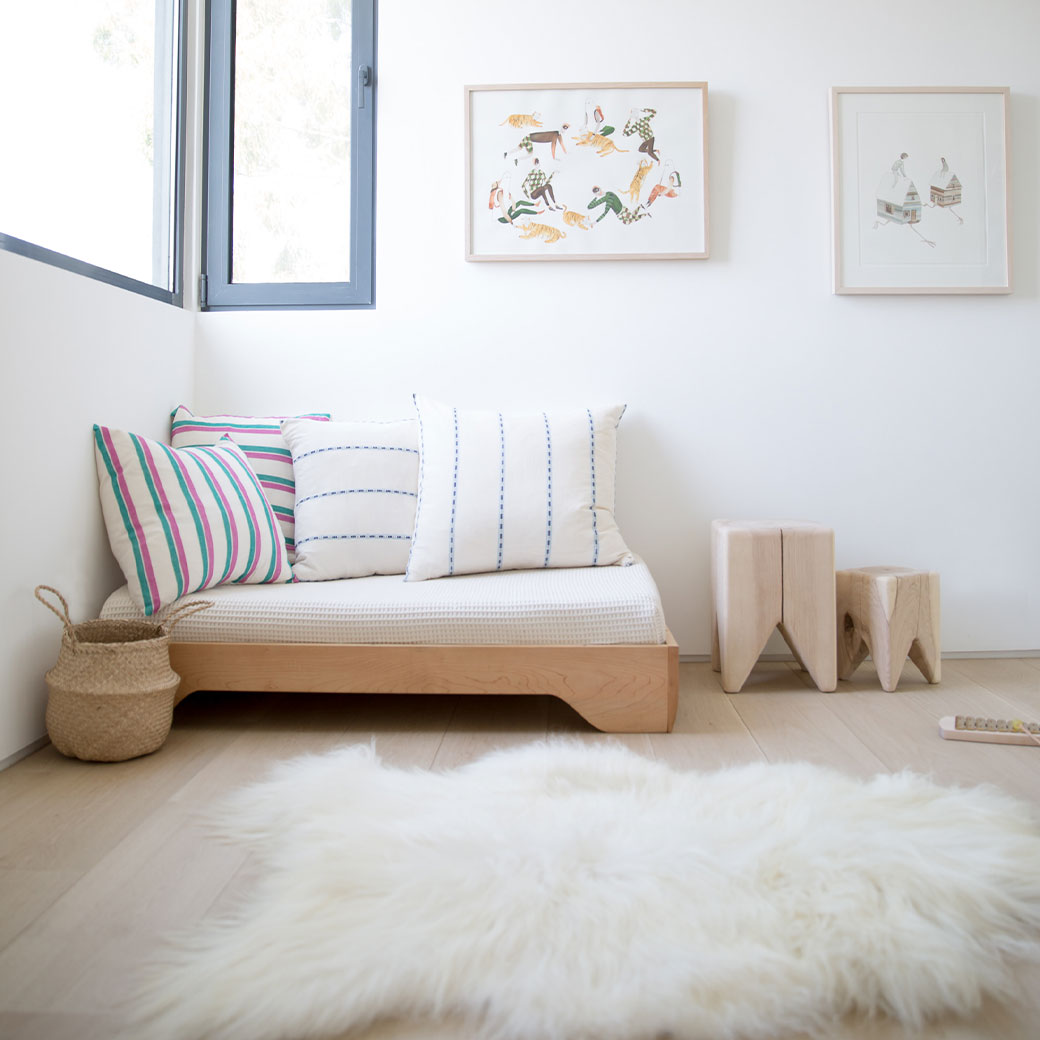 Kalon Echo Crib as platform daybed beside a window and next to two Kalon Stumps  in -- Color_Salt