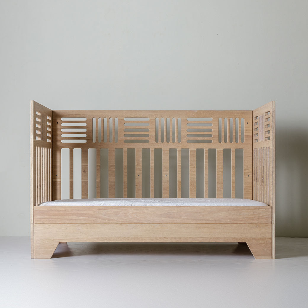 Front view of Kalon Io Crib as day bed -- Lifestyle