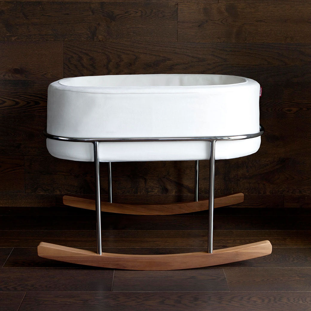 Monte Rockwell Bassinet in a wood floor room  in -- Color_White Microfiber