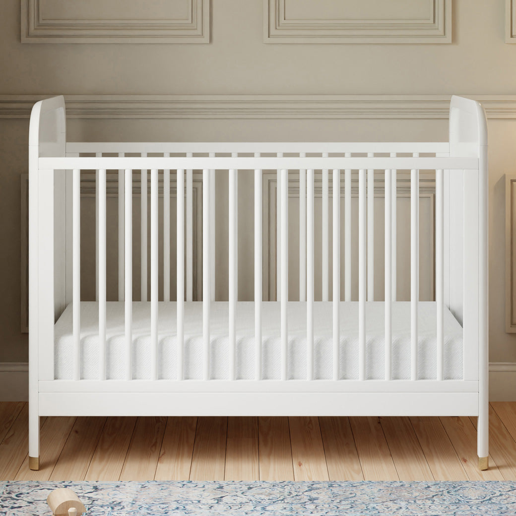 Front view of Namesake Brimsley 3-in-1 Convertible Crib in a room in -- Color_Warm White