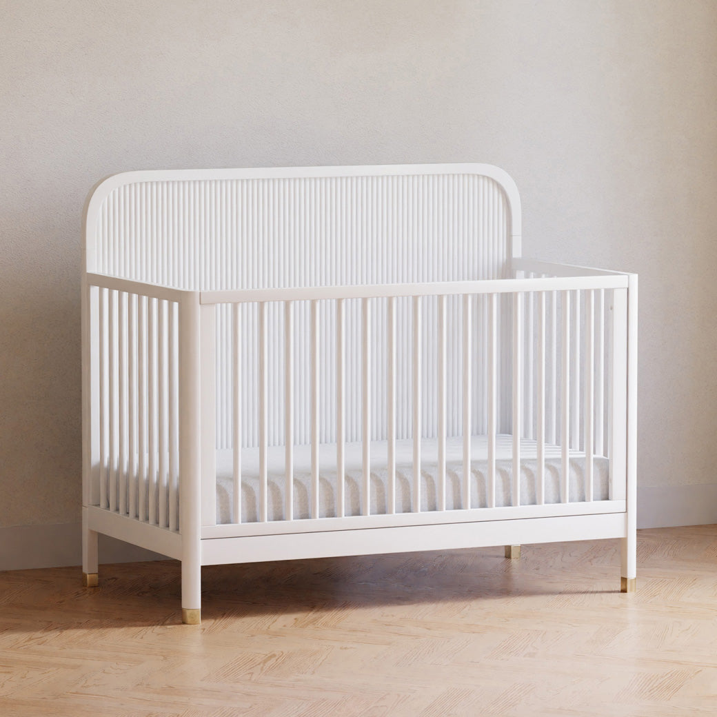 Namesake Brimsley 4-in-1 Convertible Crib in a white-wall room in -- Color_Warm White
