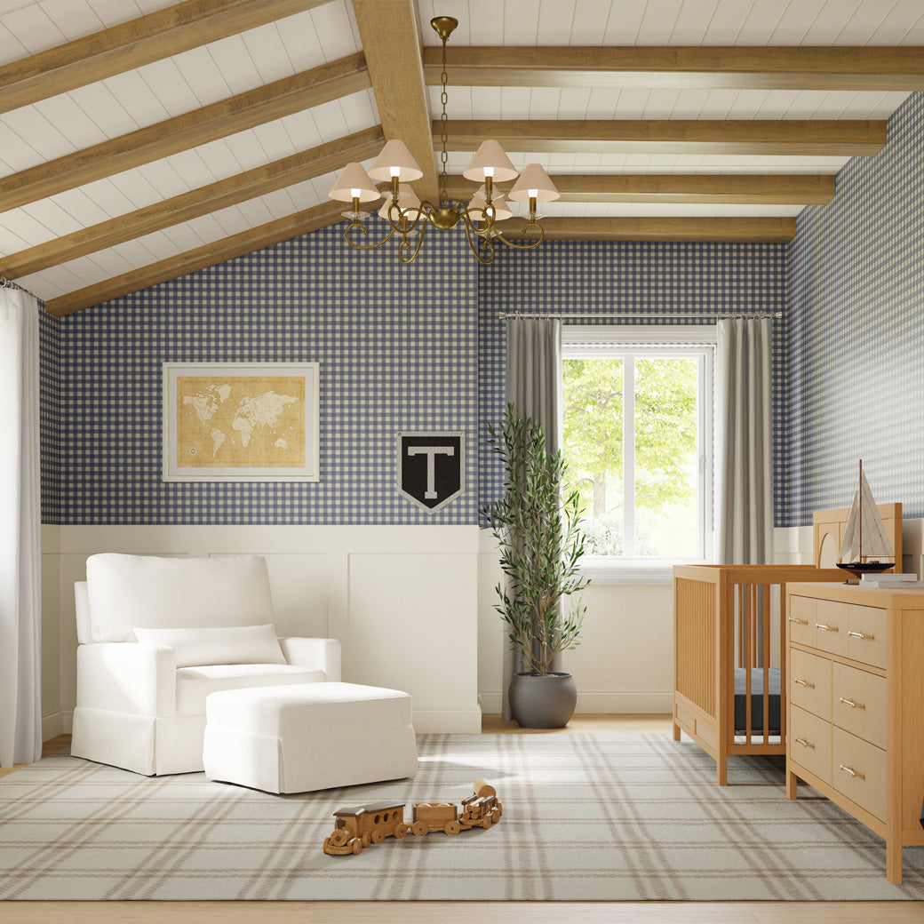 a room with a crib and a chair