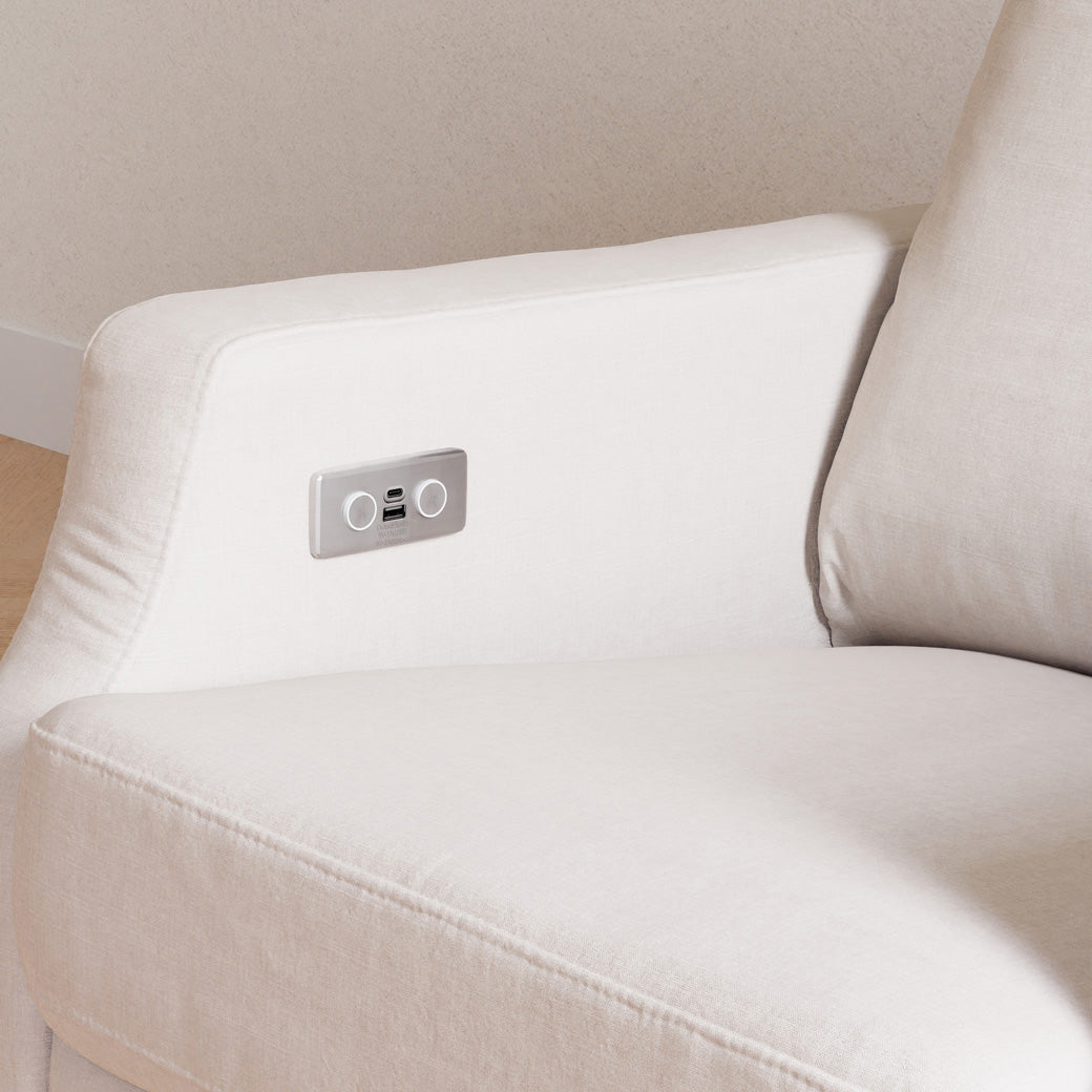 Closeup of the Namesake's Crewe Electronic Recliner & Swivel Glider in a room in -- Color_Performance Cream Eco-Weave with Light Wood Base