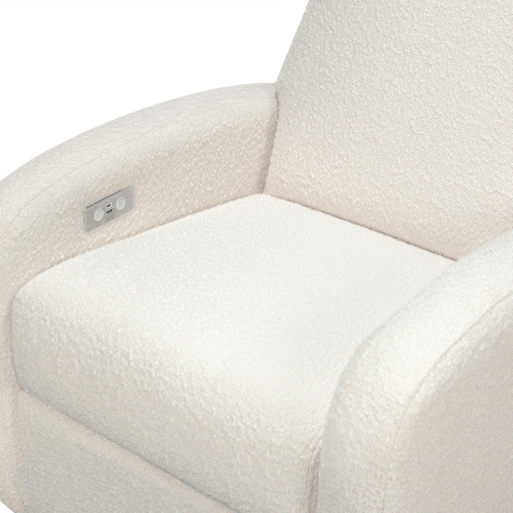 The Babyletto Nami Glider Recliner seat closeup in -- Color_Ivory Boucle With Light Wood Base