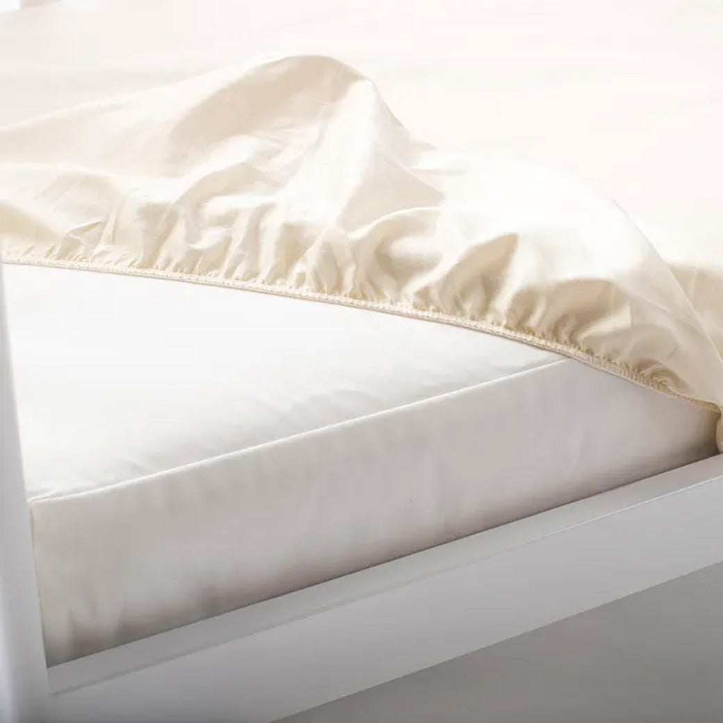 Naturepedic Oval Crib Fitted Protector Pad Modern Nursery™