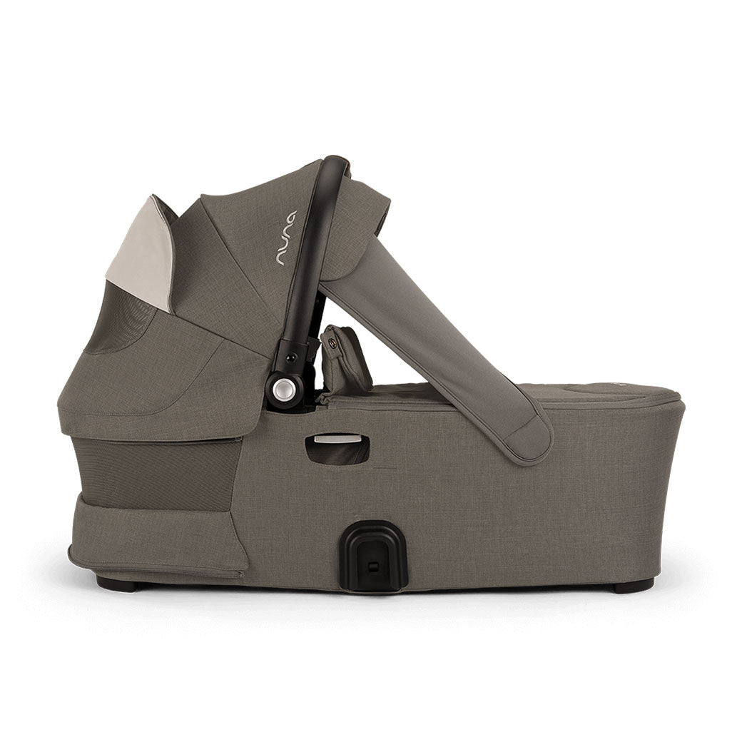 Side view of bassinet with vent down of Nuna DEMI Next Bassinet + Stand in -- Color_Granite
