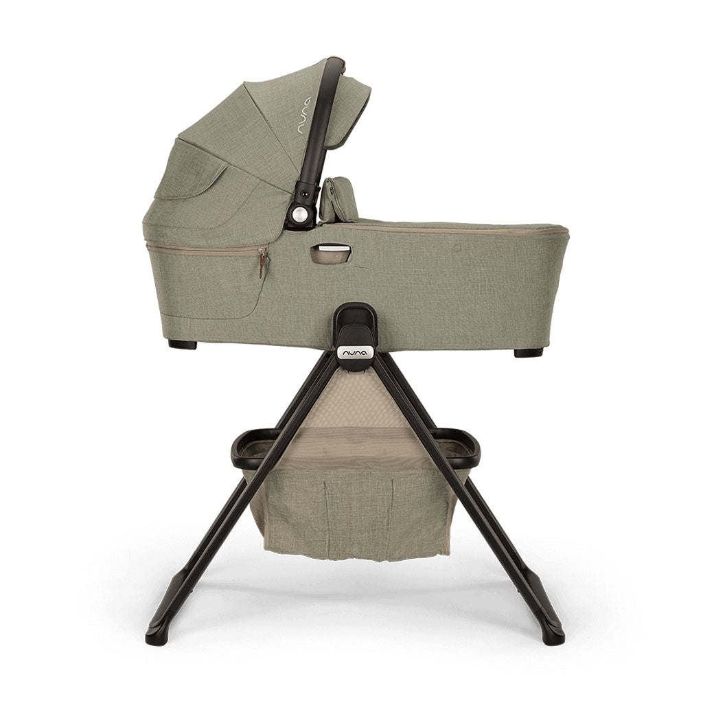 Side view of Nuna DEMI Next Bassinet + Stand in -- Color_Hazelwood