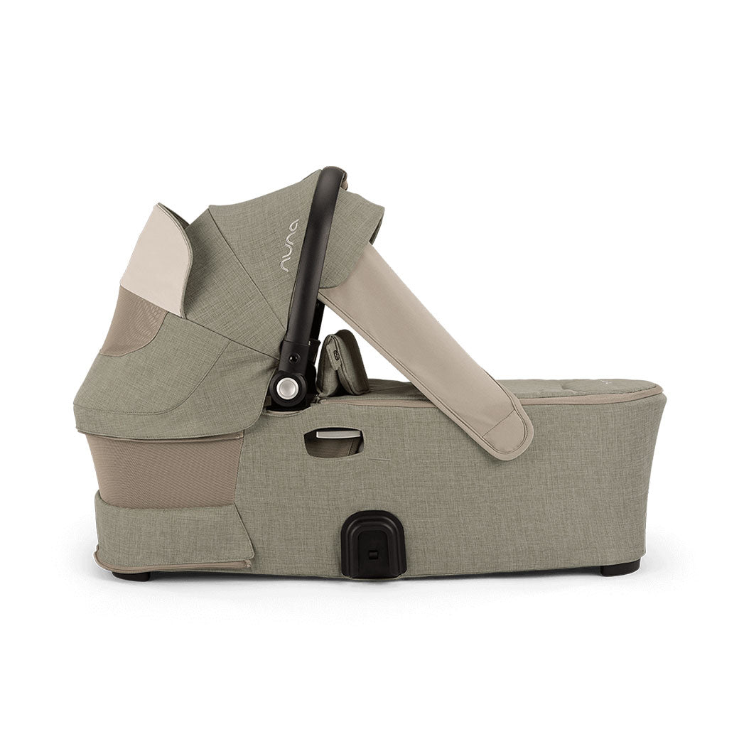 Side view of bassinet with vent down of the Nuna DEMI Next Bassinet + Stand in -- Color_Hazelwood