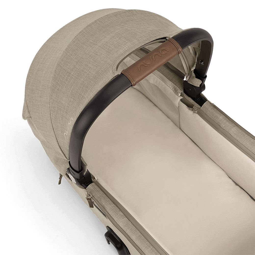 Closer view of the Nuna DEMI Next Bassinet + Stand in -- Color_Hazelwood