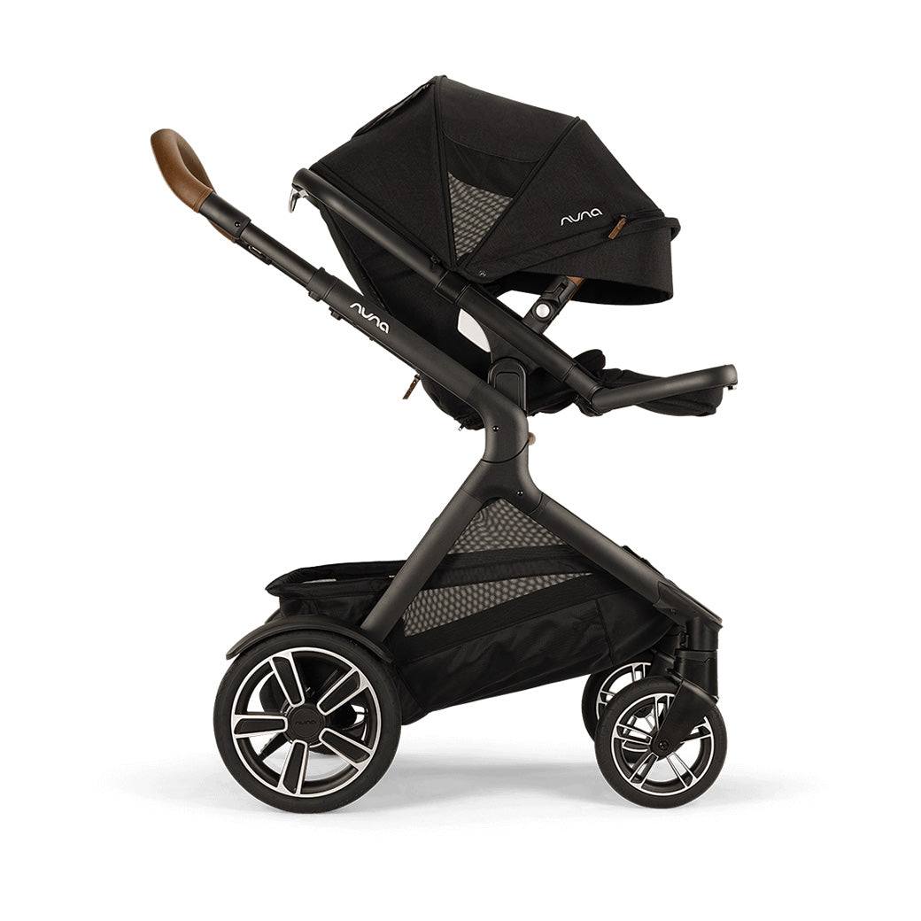 Side view of Nuna DEMI Next Stroller with canopy down and footrest up in -- Color_Caviar