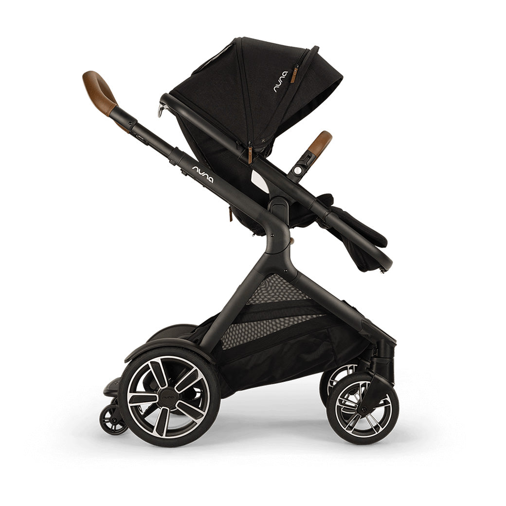Side view of Nuna DEMI Next Stroller with ride-along board down in -- Color_Caviar