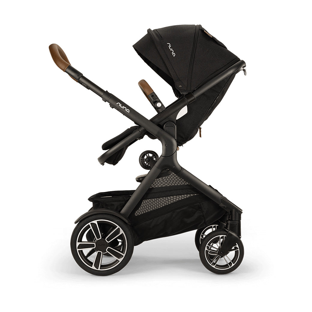 Side view of reversed Nuna DEMI Next Stroller with ride-along board up  in -- Color_Caviar