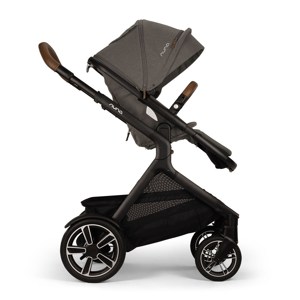 Side view of Nuna DEMI Next Stroller with footrest down in -- Color_Granite