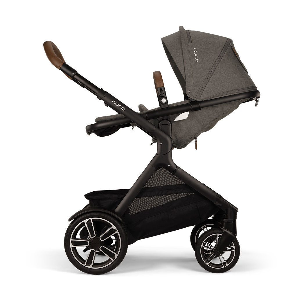Side view of reversed and reclined Nuna DEMI Next Stroller in -- Color_Granite
