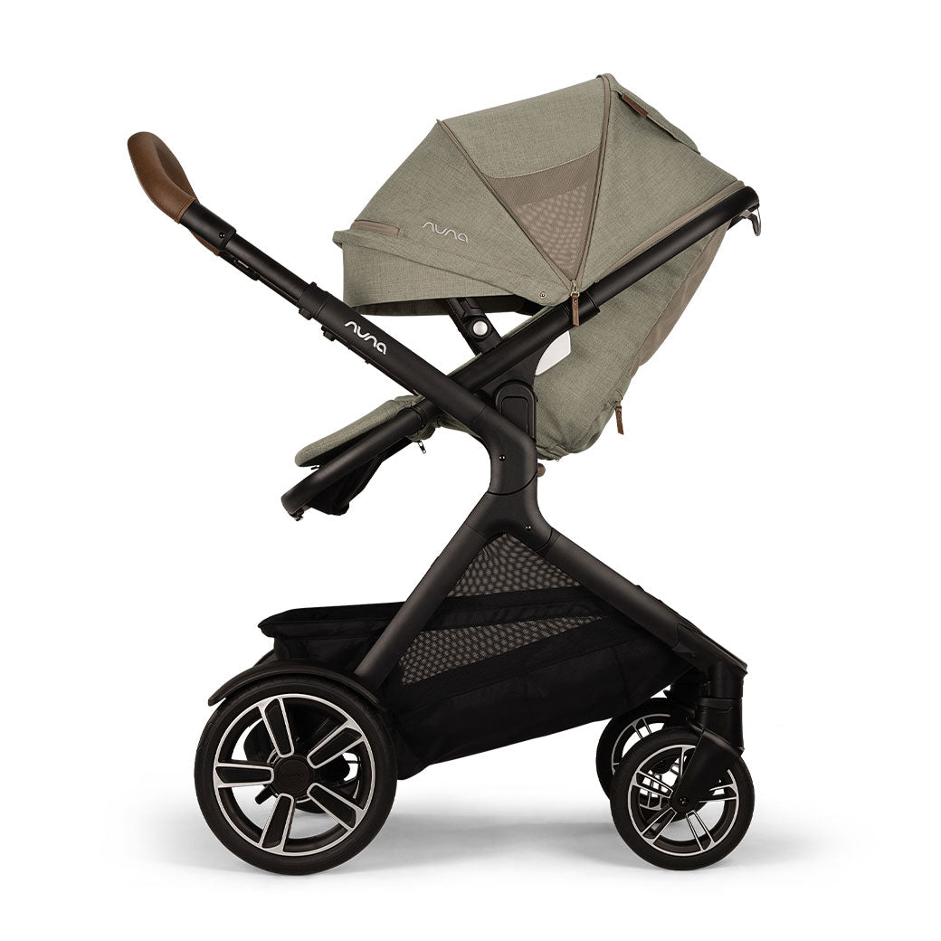 Side view of reversed Nuna DEMI Next Stroller with canopy down in -- Color_Hazelwood