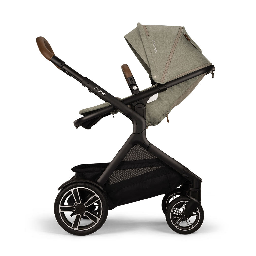 Side view of reversed and slightly reclined Nuna DEMI Next Stroller in -- Color_Hazelwood