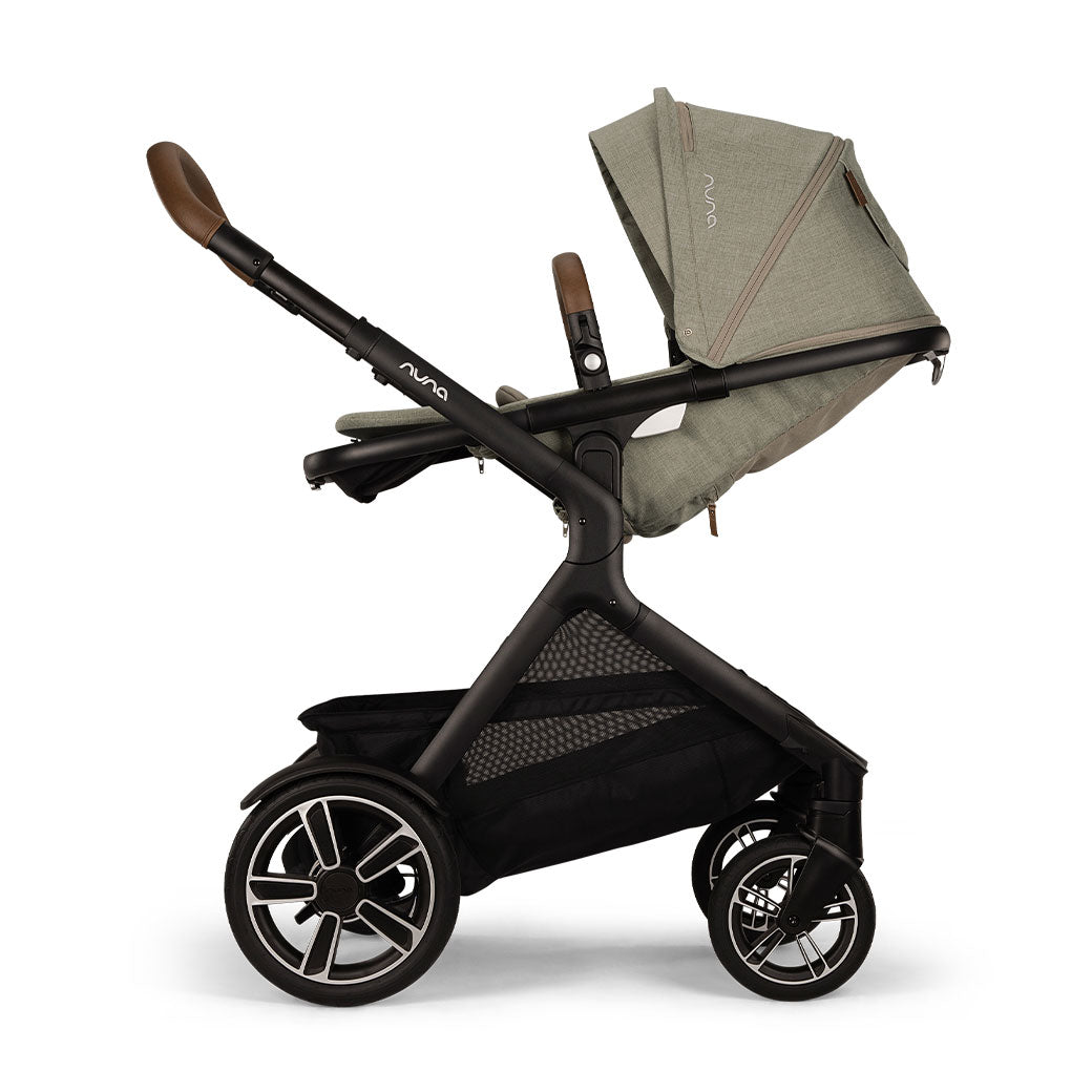 Side view of reversed and reclined Nuna DEMI Next Stroller in -- Color_Hazelwood
