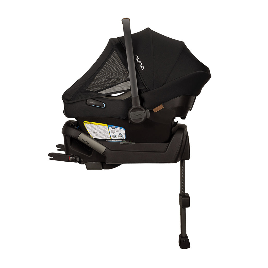 Side view of Nuna PIPA Aire Infant Car Seat + PIPA Series Base with net in -- Color_Caviar