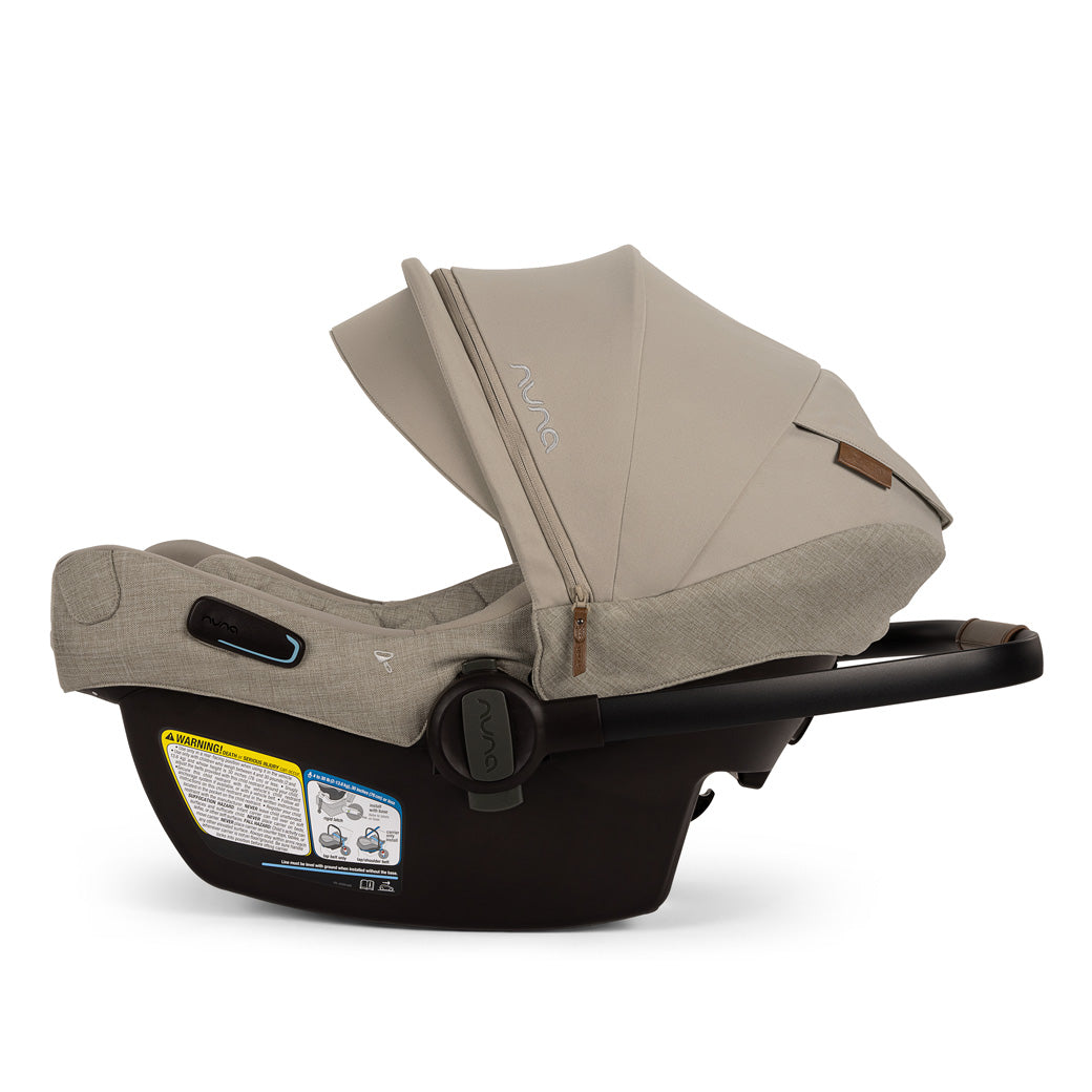 Side view of Nuna PIPA Aire RX Infant Car Seat + PIPA RELX Base without base and handle down  in -- Color_Hazelwood