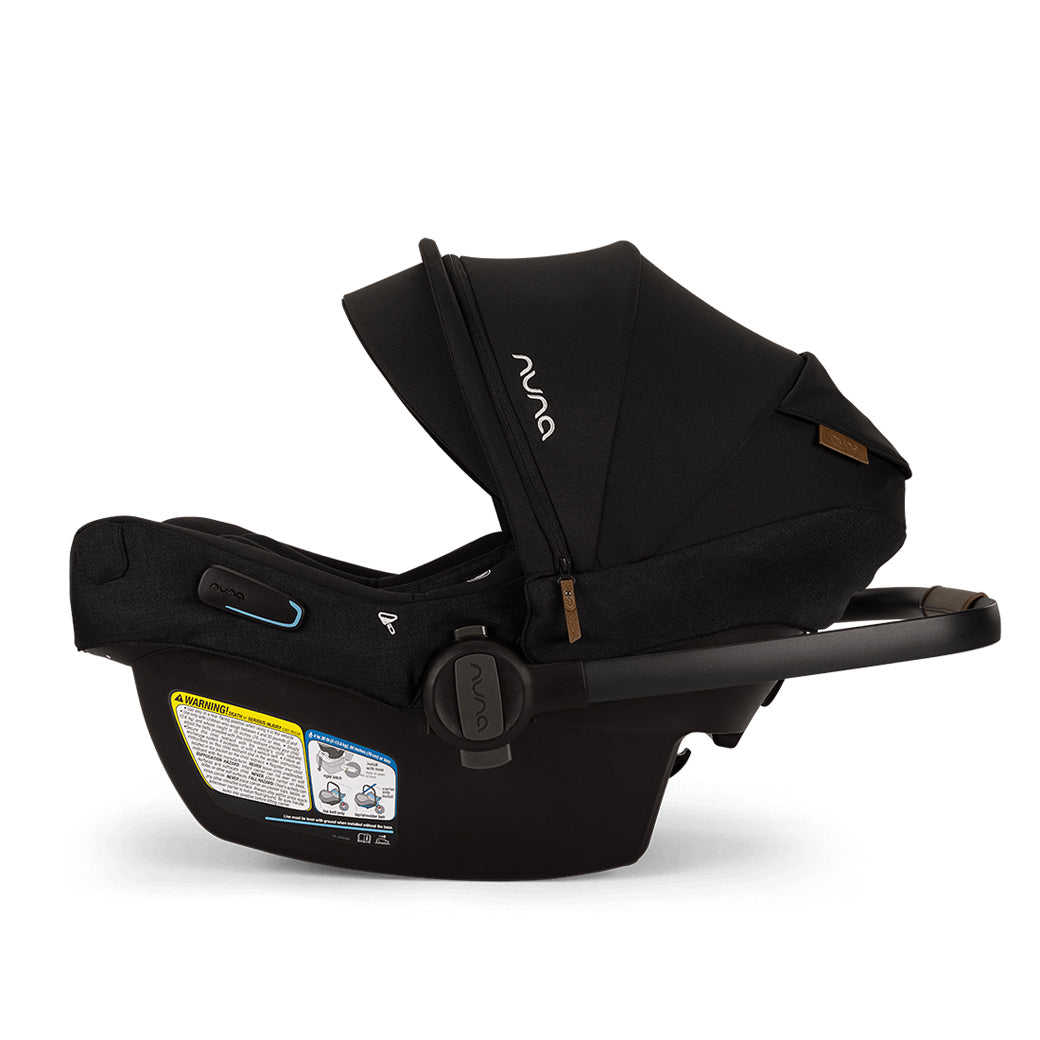 Side view of Nuna PIPA Aire RX Infant Car Seat + PIPA RELX Base without base and with handle down  in -- Color_Caviar