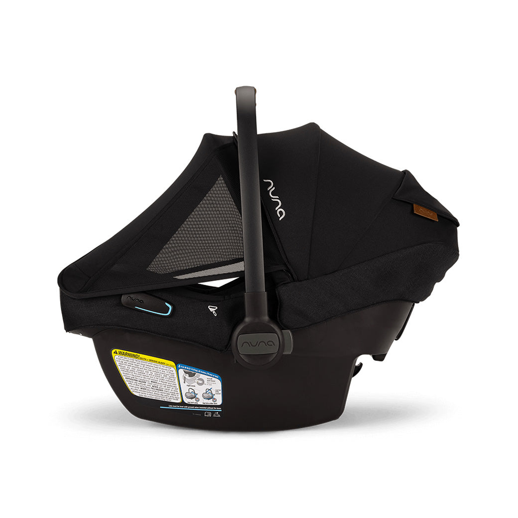 Side view of Nuna PIPA Aire RX Infant Car Seat + PIPA RELX Base without base, with canopy and net down  in -- Color_Caviar
