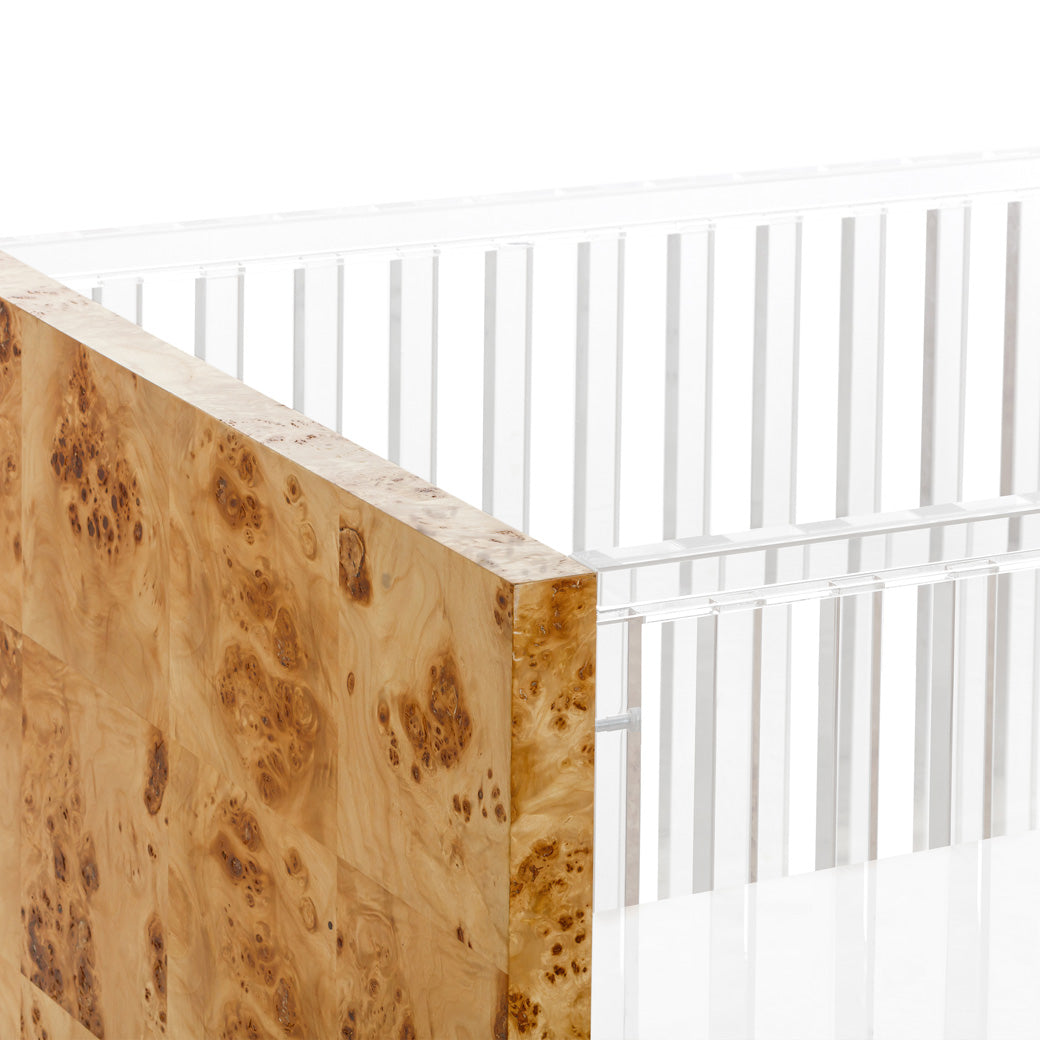 Closeup of Nursery Works Altair Crib in -- Color_Clear Acrylic with Burl