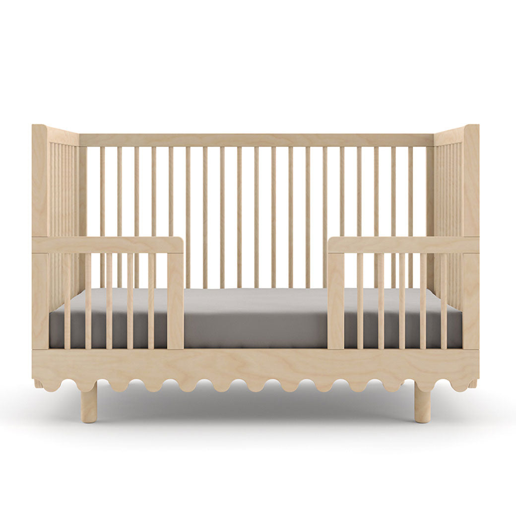 Front view of Oeuf Moss Crib as toddler bed in -- Color_Birch