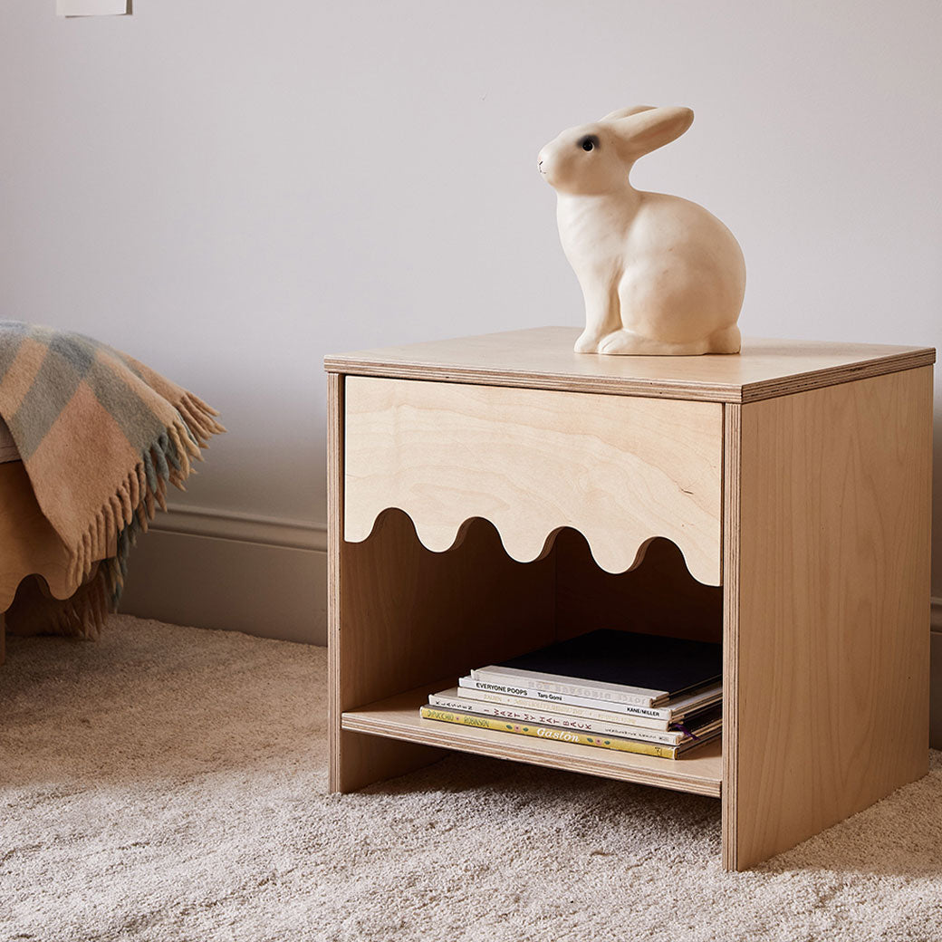 Oeuf Moss Nightstand with books on the shelf and a bunny statue on top  in -- Color_Birch