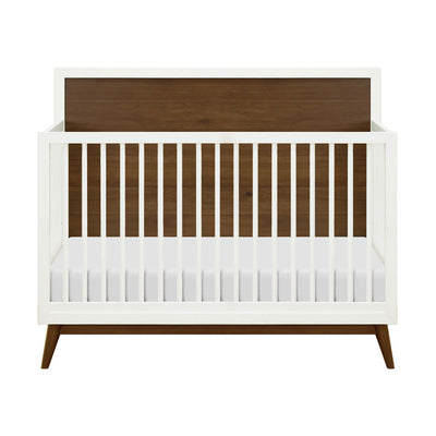 Front view of  Babyletto's Palma 4-in-1 Convertible Crib in -- Color_Warm White with Natural Walnut