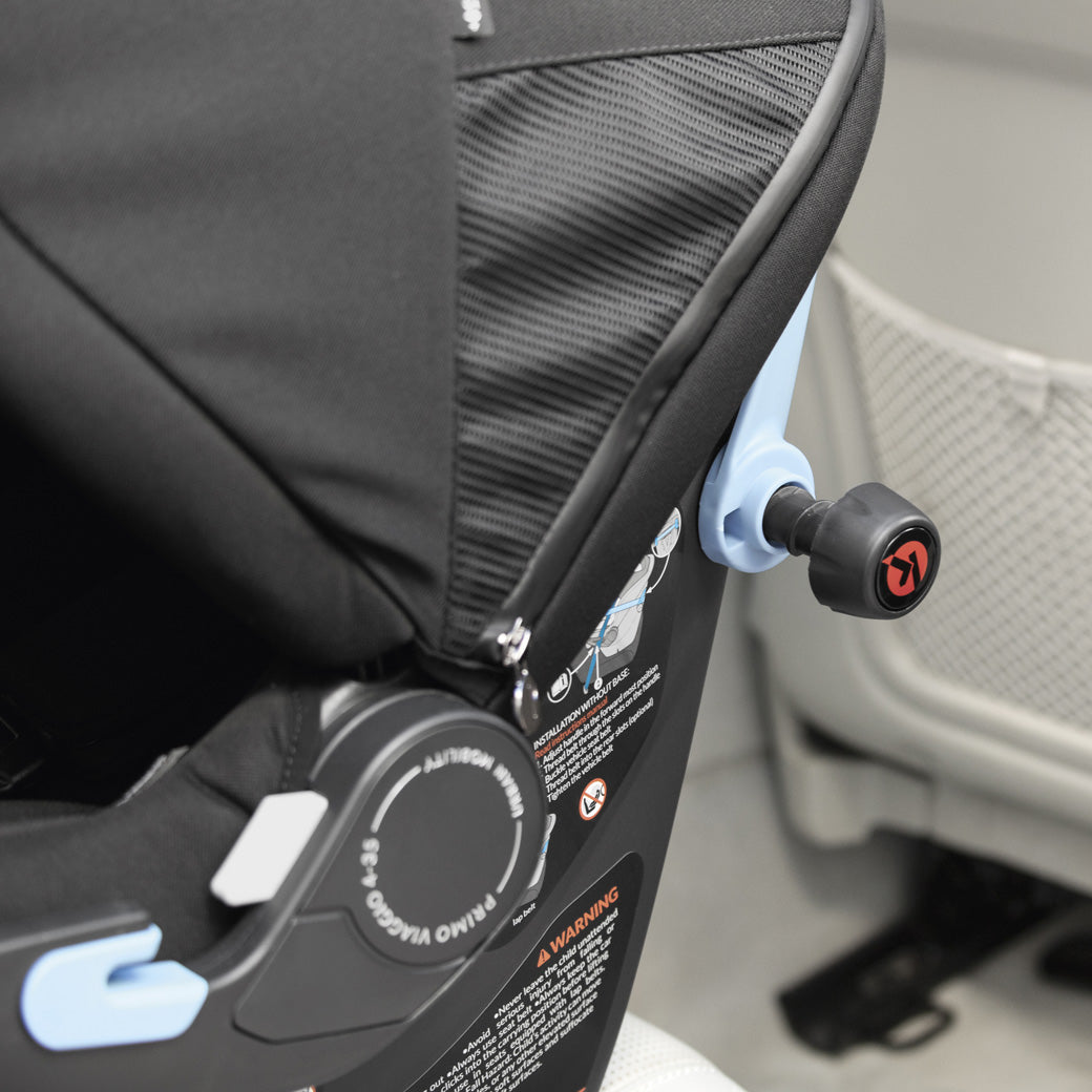 Closeup of Peg Perego Primo Viaggio 4-35 Urban Mobility Infant Car Seat mechanism in car  in -- Color_True Black