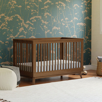 Babyletto's Scoot 3-in-1 Convertible Crib in a room in -- Color_Natural Walnut