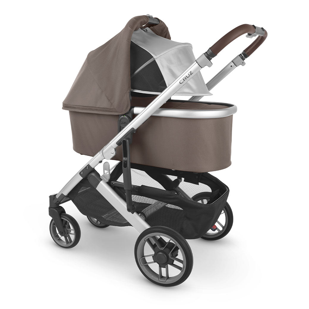 Angled view of the UPPAbaby Bassinet on the Cruz V2 with sunshade down  in -- Color_Theo