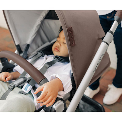 Baby sleeping in the UPPAbaby VISTA V2 Travel System stroller in -- Color_Theo