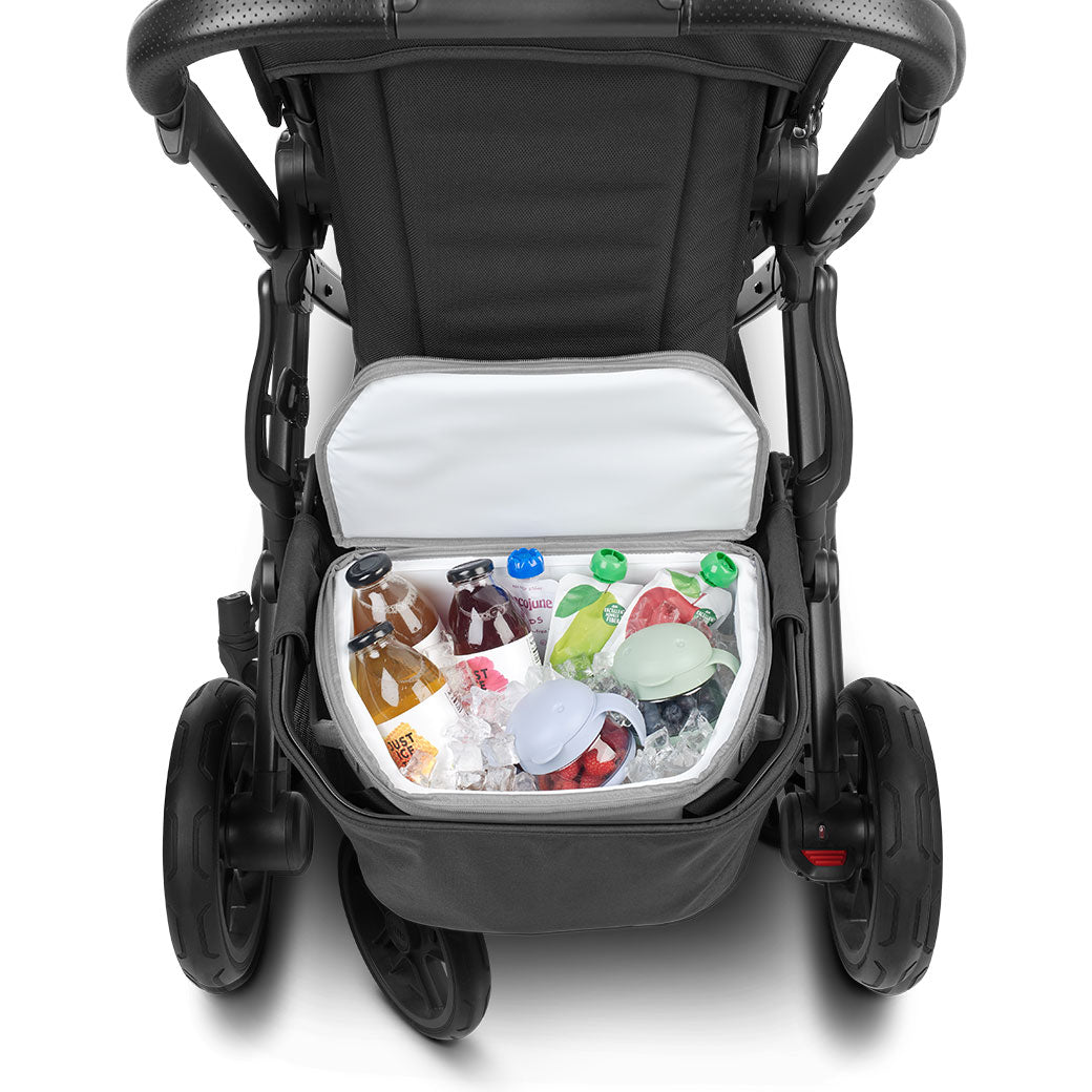 Closeup of open UPPAbaby Bevvy Stroller Basket Cooler with food and beverages inside 