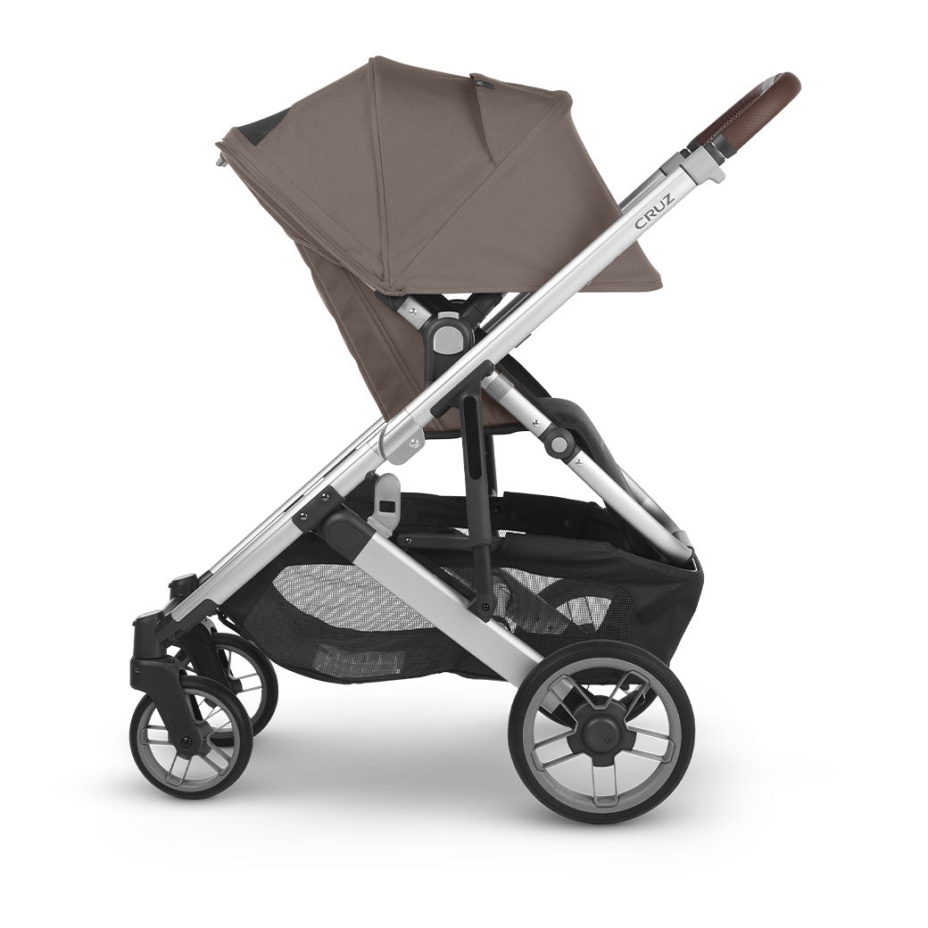 Side view of reversed UPPAbaby Cruz V2 Stroller with sunshade down in -- Color_Theo