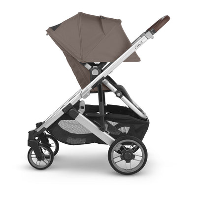 Side view of reversed UPPAbaby CRUZ V2 Travel System stroller with canopy down  in -- Color_Theo