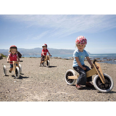 Three toddlers on OB-135 3-in-1 Bikes