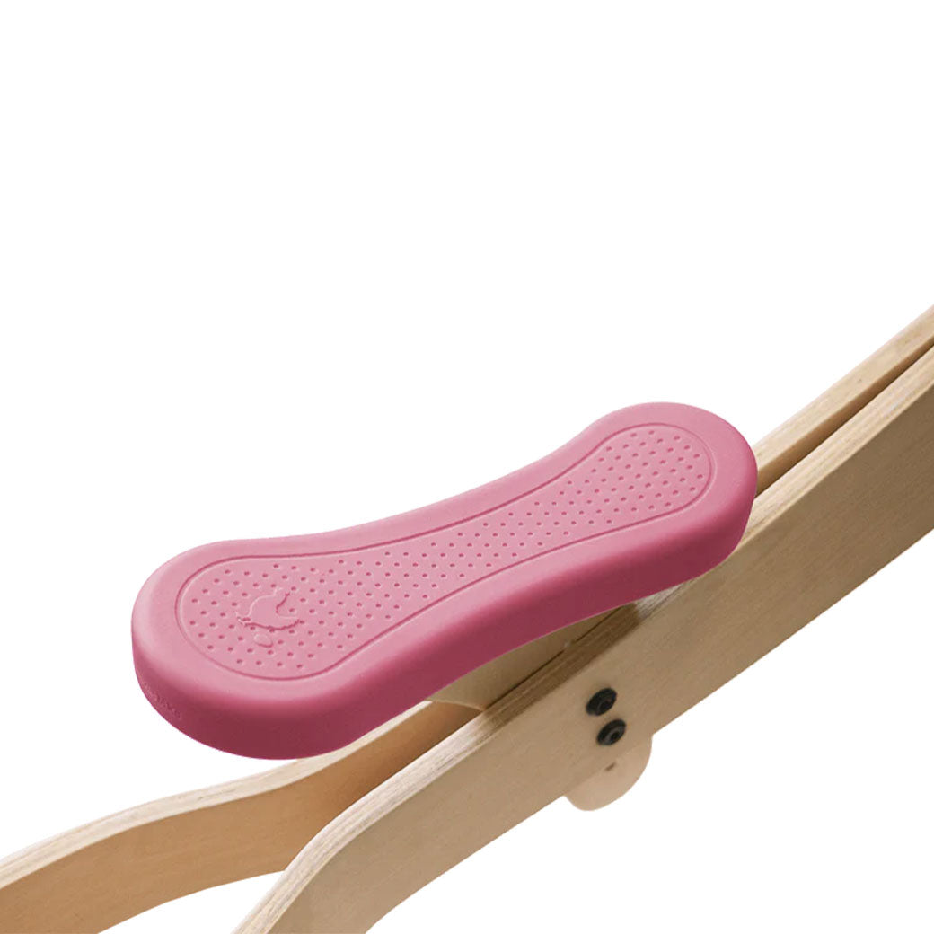 Closeup of seat of Wishbone 3-in-1 Bike + Seat Cover in -- Color_Pink