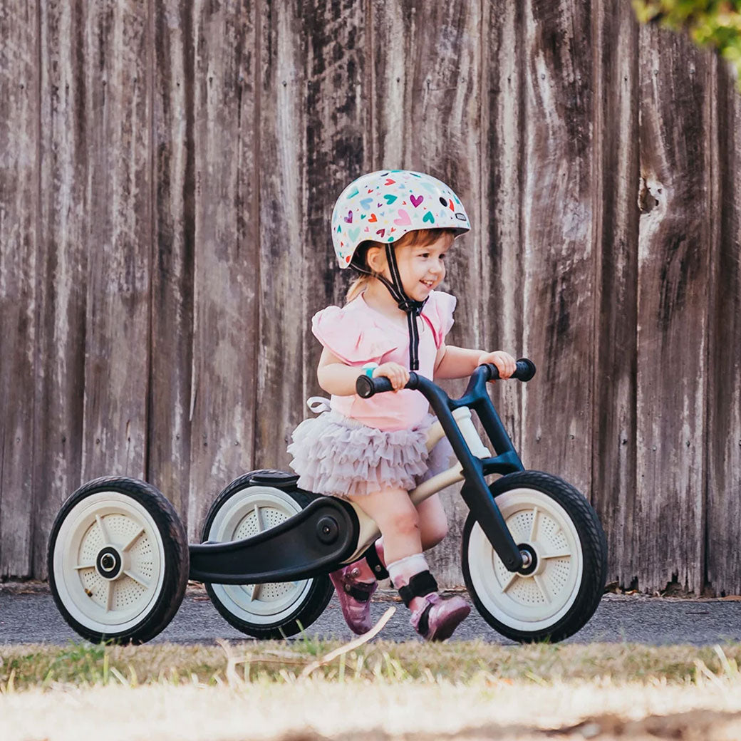 Little girl with helmet on the Wishbone Bike RE2 3 in 1 in -- Lifestyle