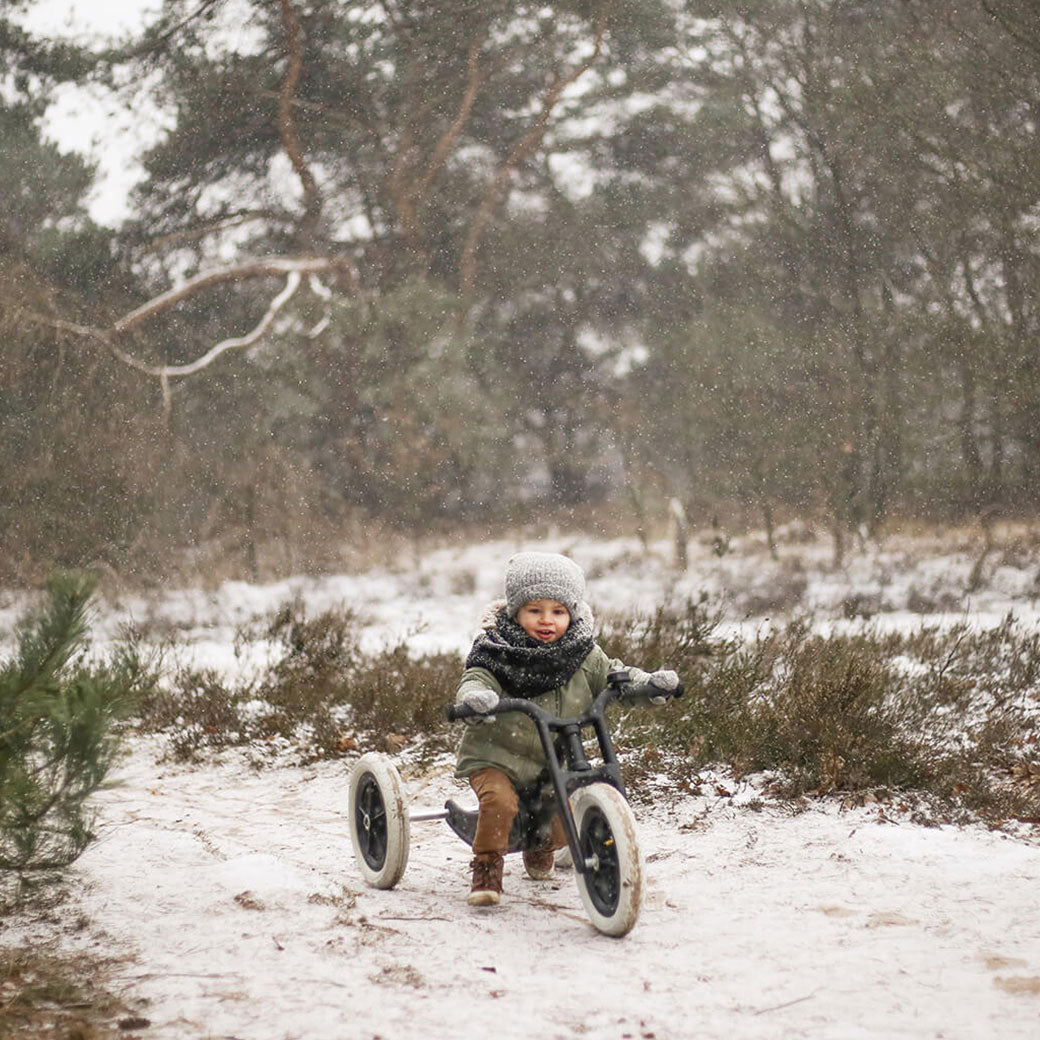 Toddler on Wishbone Bike RE2 3 in 1 with three wheels on trail with snow  in -- Lifestyle