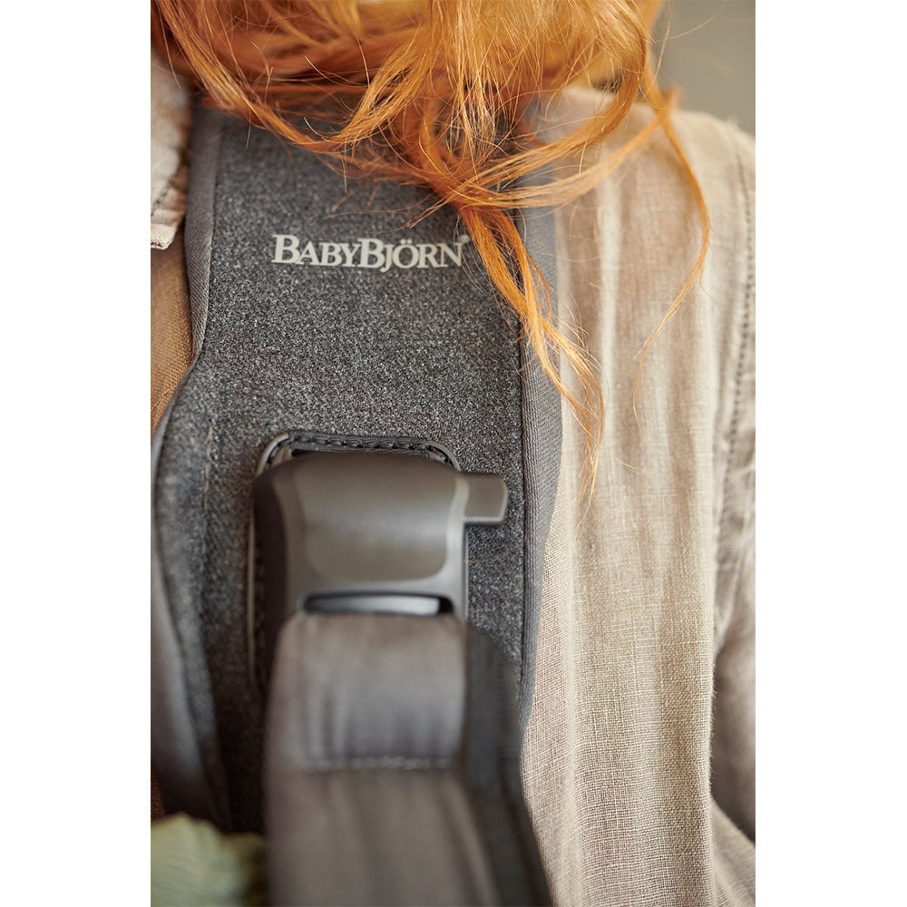 Logo on the BABYBJÖRN Baby Carrier One in -- Color_Denim Gray/Dark Gray Cotton