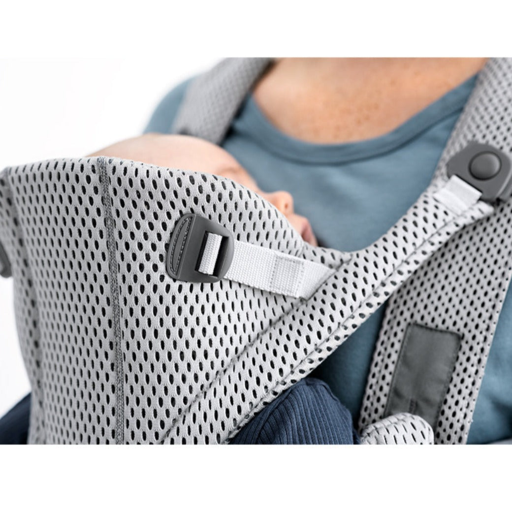 Up close side view of baby in the BABYBJÖRN Baby Carrier Free in -- Color_Gray 3D Mesh